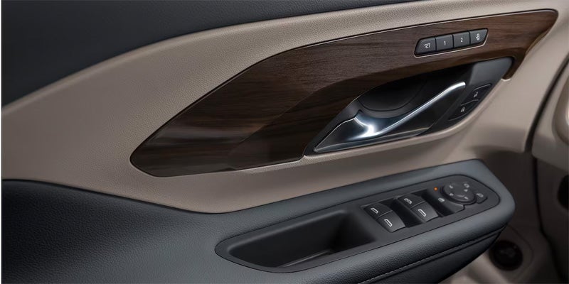 View of the door handle of a 2024 GMC Terrain featuring child safety locks