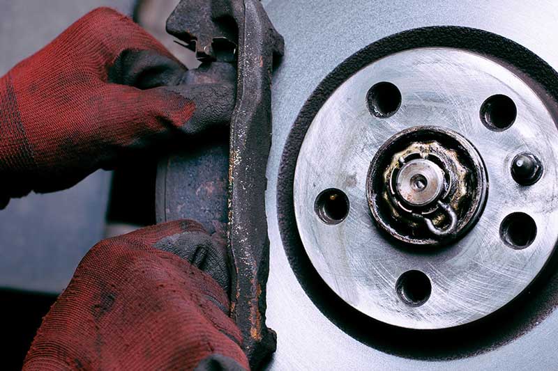 Brake pad and rotor on a GMC vehicle during a service inspection
